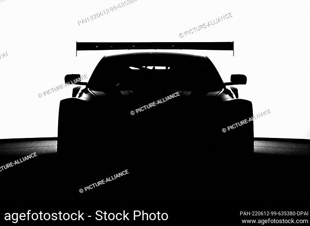 04 June 2022, Baden-Wuerttemberg, Schiltach: Aston Martin Vantage GT3 race car is silhouetted against white background. Photo: Silas Stein/