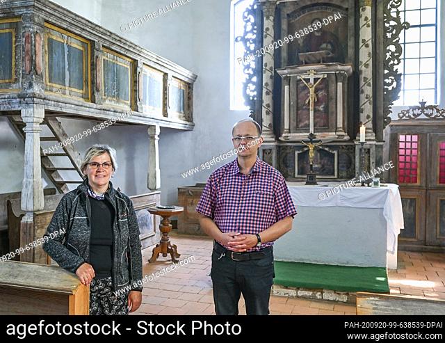 17 September 2020, Brandenburg, Illmersdorf: Verena Jolske-Dittrich, church leader, and Robert Marnitz, pastor, stand in the small village church