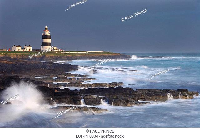 Ireland, County Wexford, Hook Head, A view toward Hook Lighthouse. It was built in the thirteenth century as a navigation aid by William Marshall