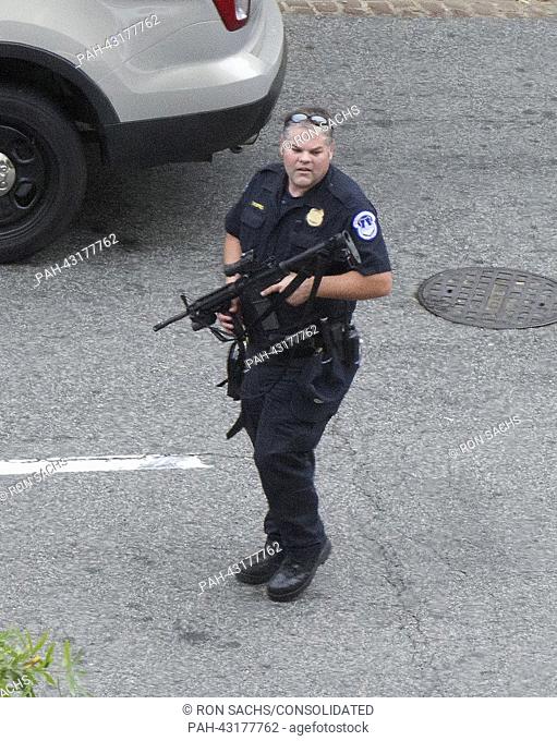 United States Capitol Police sharpshooter outside the Hart Senate Office Building following reports of a shooting incident on Capitol Hill in Washington, D