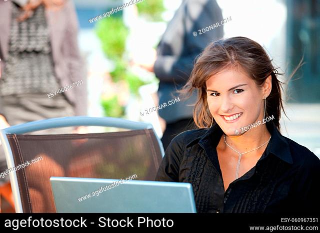 Closeup portrait of happy young businesswoman, smiling
