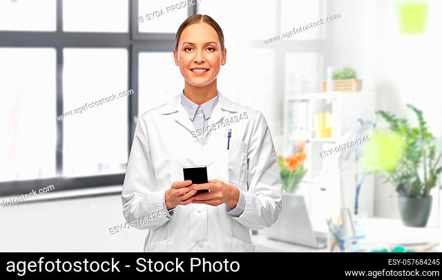 happy female doctor with smartphone at hospital