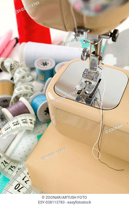 Sewing machine, fabric and measurement tape
