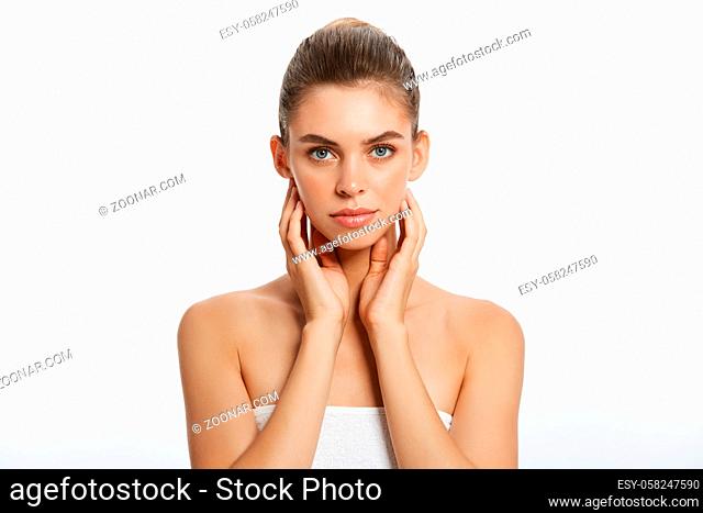 Beauty face of young woman. Skin care concept. Closeup portrait isolated on white