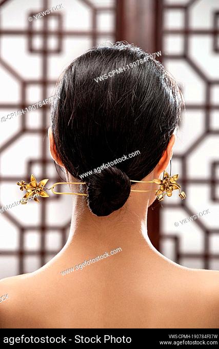 Oriental woman with Chinese buns