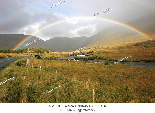 Rainbow over country-road at Delphi , Connemara , Connacht , Ireland , Europe