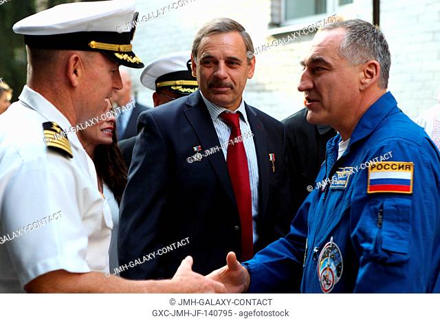 At the Gagarin Cosmonaut Training Center in Star City, Russia, Expedition 41 Flight Engineer Barry Wilmore of NASA (left) greets Expedition 40 Soyuz Commander...