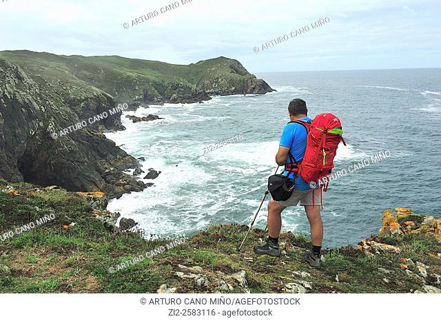 A hiker on the Costa da Morte. Finisterre, La Coruña, Spain