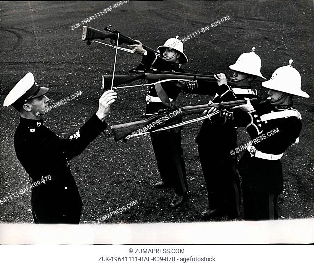 Nov. 11, 1964 - Bandmaster Albert Hall and his 'Sweet music' introducing the musical rifle; After months of practice three members of the Royal Marine Band have...