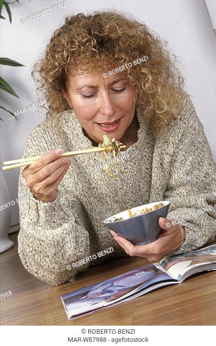 woman eating chinese food