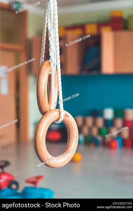 Close up of gym rings in the gym hall of a preschool