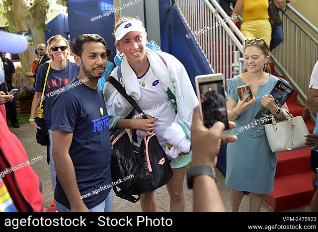 Belgian Elise Mertens poses with fans after a game between Belgian Elise Mertens and Chinese Quang Wang in the women's singles first round at the 2020 Dubai...