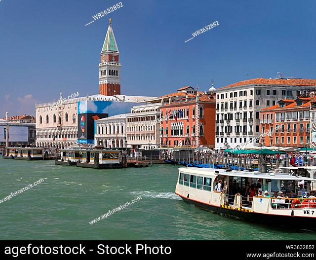 VENICE, ITALY - JULY 10: Water front with public transport vessels in Venice on JULY 10, 2011. Water front coast in Venice, Italy