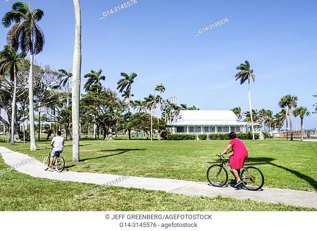 Florida, West Palm Beach, riding bicycles, Currie Park, man, woman, Maritime Museum