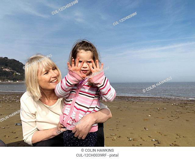 mature woman with child on beach