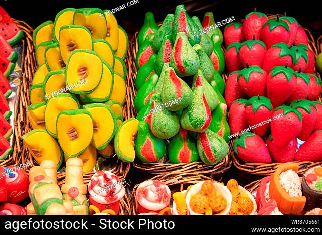 Mixed colourful delicious and tasty fruit sweets garnished with sugar