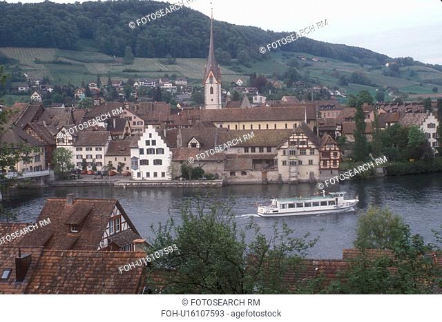 Switzerland, Rhine River, Stein, Europe, View of a tourboat cruising along the Rhine River in the picturesque village of Stein am Rhein in the Canton of...