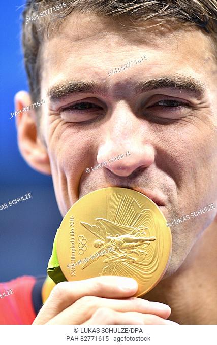 Michael Phelps of the USA reacts after the Men's 4 x 100m Medley Relay Final of the Swimming events of the Rio 2016 Olympic Games at the Olympic Aquatics...