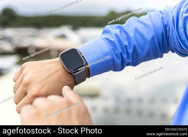 Smart watch on the man's hand. Technology and electronics