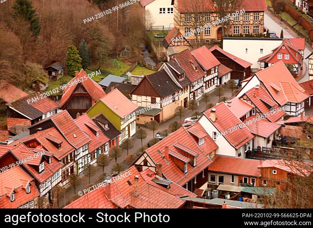 ILLUSTRATION - 02 January 2022, Saxony-Anhalt, Stolberg: View of the roofs of old half-timbered houses in the Harz village of Stolberg