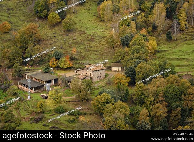 Forests and a country house on the Puigsacalm north face, between VidrÃ  and Sant Privat d'en Bas in autumn (Garrotxa, Catalonia, Spain)