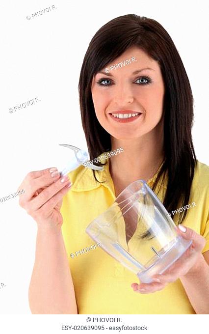 Woman holding food blender