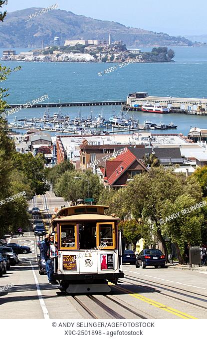 A Cable Car Going down Hyde Street in Downtown San Francisco, USA