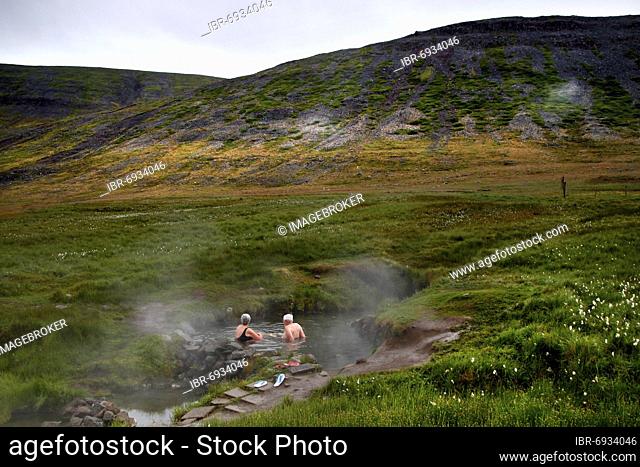 Natural pool, hot pot, geothermal spring, couple bathing Reykjafjarðarlaug, Vestfirðir, Westfjords, Iceland, Europe