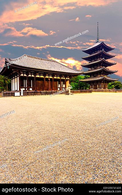 The front of the East Golden Hall, To-kondo, and five story pagoda, Goju-no-to, in Kofuku-ji Buddhist temple on beautiful sunset evening in Nara, Japan