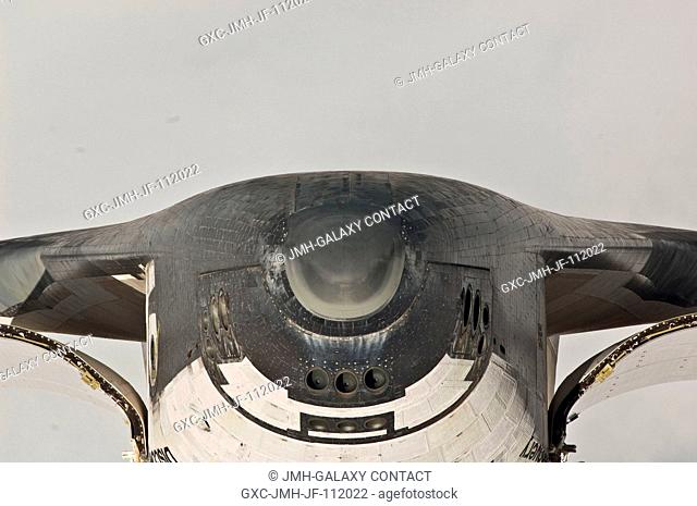 This view of the nose and the forward underside of the space shuttle Discovery was provided by an Expedition 26 crew member during a survey of the approaching...