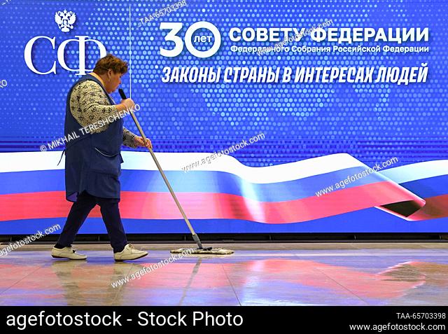 RUSSIA, MOSCOW - DECEMBER 13, 2023: A cleaning lady washes the floor at the Russian Federation Council headquarters. Mikhail Tereshchenko/TASS