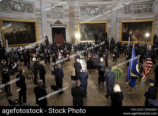 People attend a ceremony for Capitol Police officer Brian Sicknick in the Rotunda of the US Capitol building after he died during the January 6th attack on...