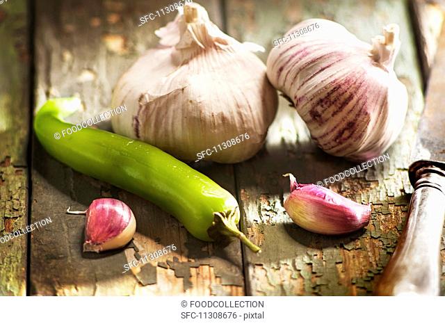 Pink garlic and a green chilli pepper