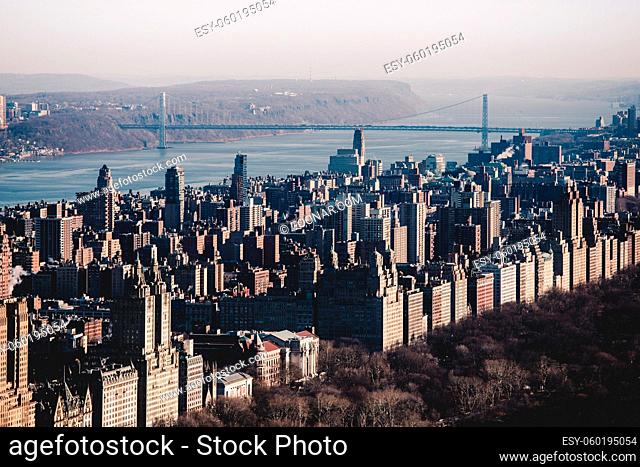 Panoramic elevated view of Central Park, Upper West Side and the George Washington Bridge with Hudson River in Fall. Manhattan, New York City, USA