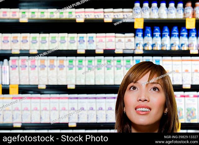 Young woman shopping in a supermarket