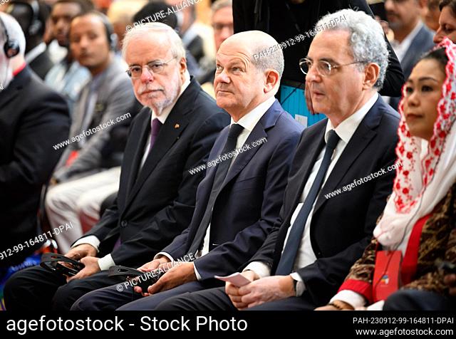 12 September 2023, Berlin: German Chancellor Olaf Scholz (M, SPD), Marco Impagliazzo (r), president of the Community of Sant'Egidio, and Andrea Riccardi (l)