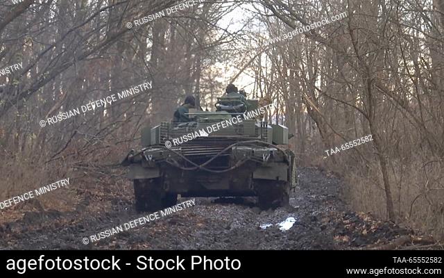 RUSSIA - DECEMBER 8, 2023: This video screen grab shows a combat mission by Russian Army Western Military District troops involving the use of T-80BVM tanks