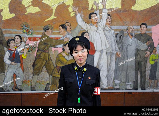 Pyongyang, North Korea, Asia - A female platform attendant at an underground station of the Pyongyang Metro in the North Korean capital city