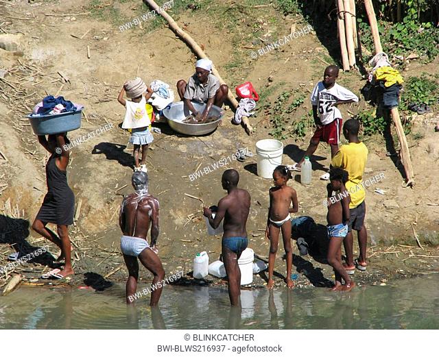men having a bath in a river, women washing clothes, Haiti, Grande Anse, Jeremie