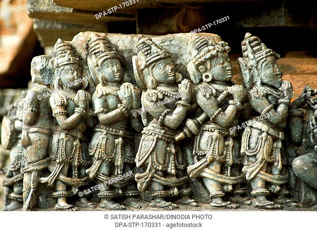 Statues of male praying carved on hoysaleswara temple ; Halebid Halebidu ; Hassan ; Karnataka ; India