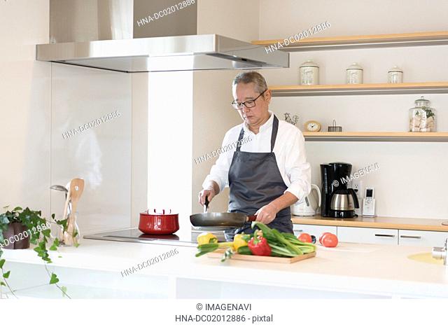 Scene of Senior man cooking