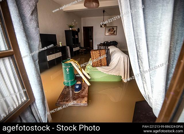 13 December 2022, Portugal, Lissabon: View into the living room of a flooded house. Heavy rains have caused damage to streets