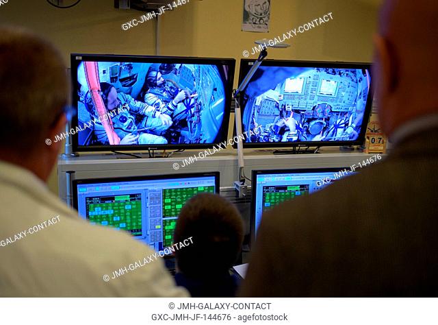 Expedition 52 crew members are seen on monitors in a control room as they participate in their Soyuz qualification exams, Friday, July 7