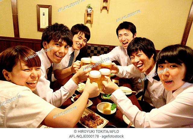 Japanese business people drinking at a Japanese style Izakaya