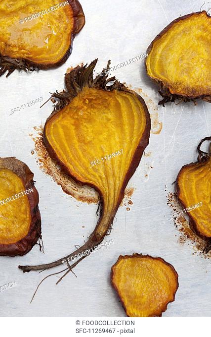 Halved and roasted golden beets with salt and pepper