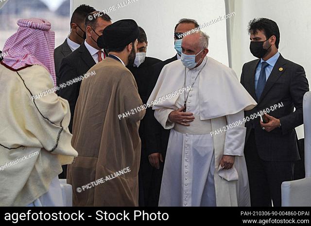 06 March 2021, Iraq, Nasiriyah: Pope Francis (2nd R) arrives to attend an interfaith prayer in the Sumerian city-state Ur