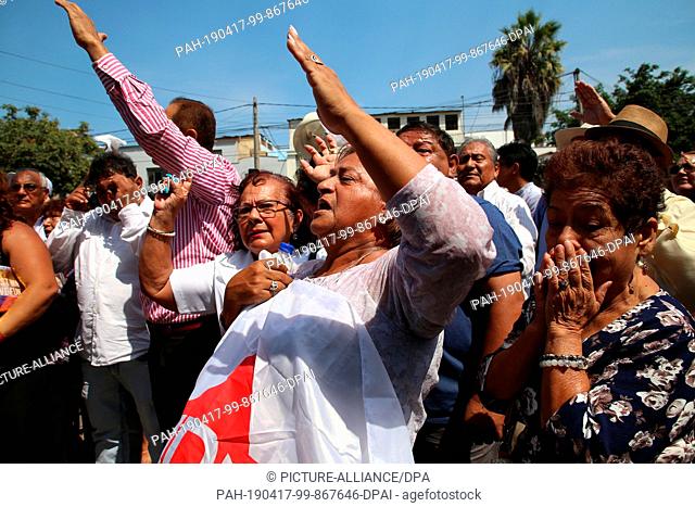 17 April 2019, Peru, Lima: Supporters of former Peruvian President Alan Garcia are waiting in front of the hospital where the former head of state was admitted