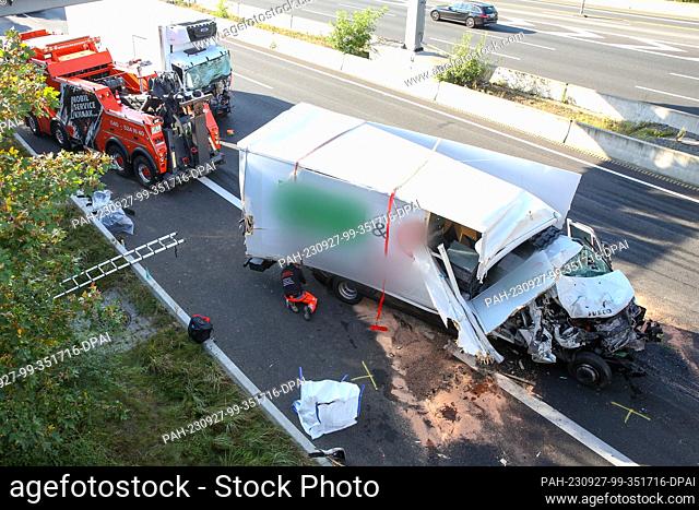27 September 2023, Hamburg: A badly damaged truck stands on the northbound A7 highway after a serious accident. In a rear-end collision involving three trucks...
