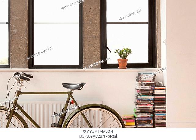 Apartment interior with bicycle and cd collection