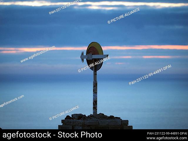 24 August 2023, Norway, Nordkapp: The Midnight Sun Monument is a sculpture in the shape of an arrow, taken in the early morning on the North Cape's slate...